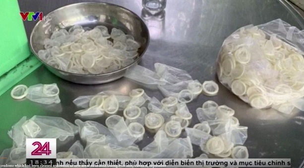 Юго-восточная Азия - Used condoms which had been cleaned and resold as new are seen in Binh Duong Province, Vietnam, September 22, 2020, in this still from video. REUTERS Reuters TV VTV.JPG